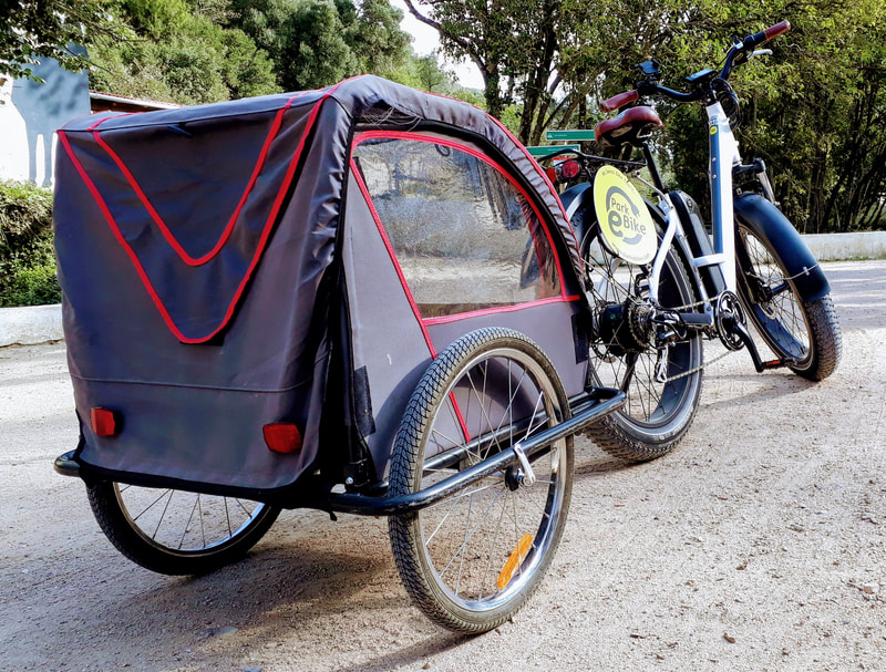 Fat tire ebike with child trailer at Quinta do Pisao in Cascais